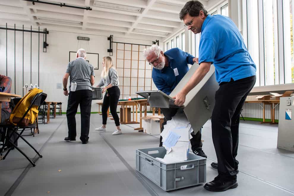 Swiss voters are casting final ballots in a general election (Ennio Leanza/Keystone/AP)
