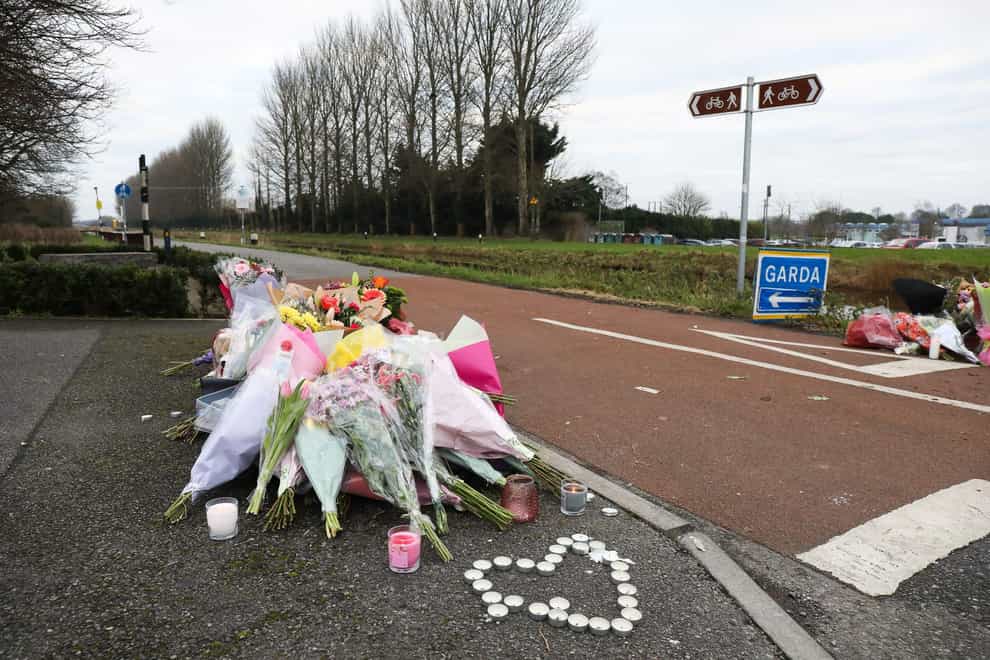 Floral tributes near the Grand Canal in Tullamore after the death of Ashling Murphy (PA)