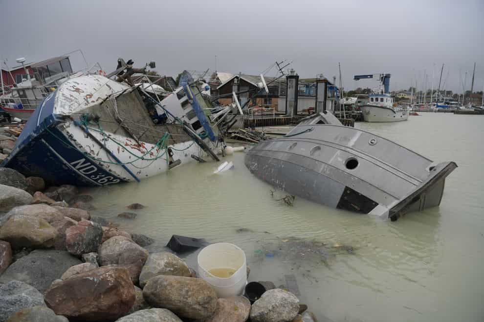 Flooding and storms cause billions of pounds of damage around the world each year (Nils Meilvang/AP)