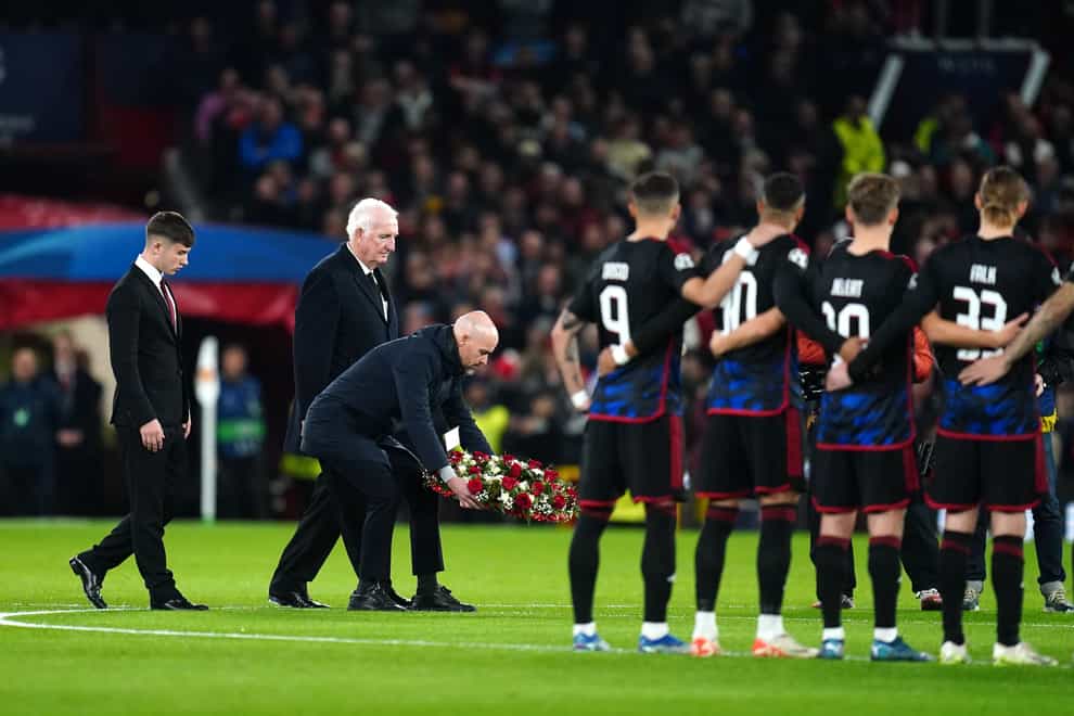 Manchester United manager Erik ten Hag (centre) lays a wreath in tribute to Sir Bobby Charlton (Nick Potts/PA)