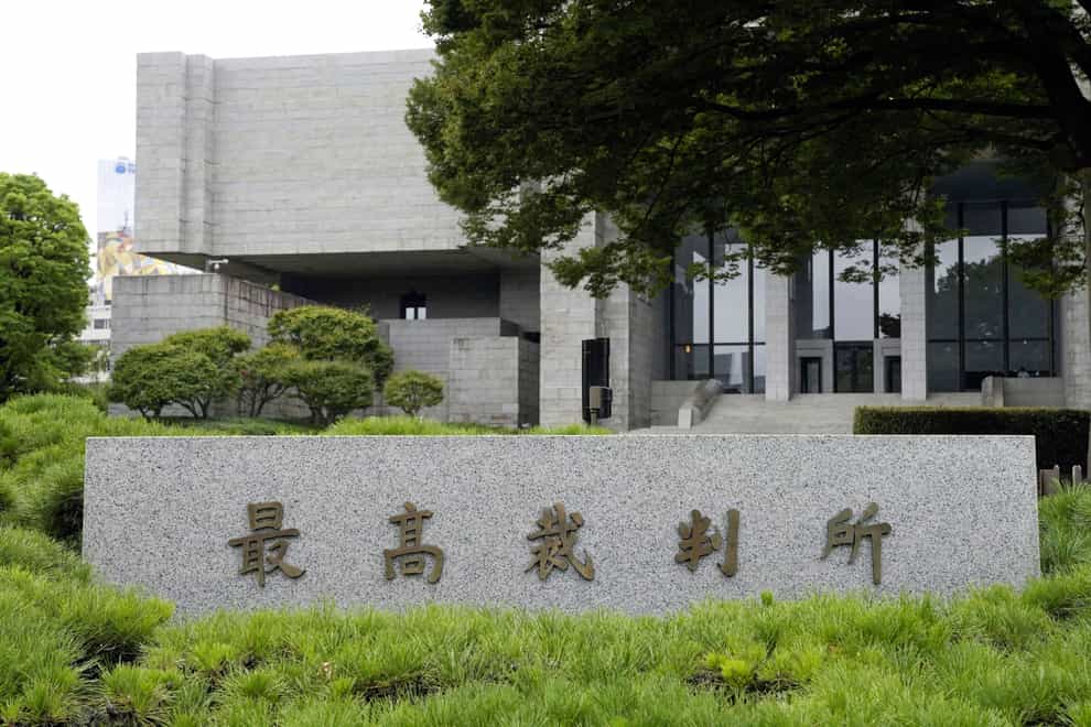 Japan’s Supreme Court has ruled that a law requiring transgender people to undergo sterilisation surgery in order to officially change their gender is unconstitutional (Kyodo News/AP)