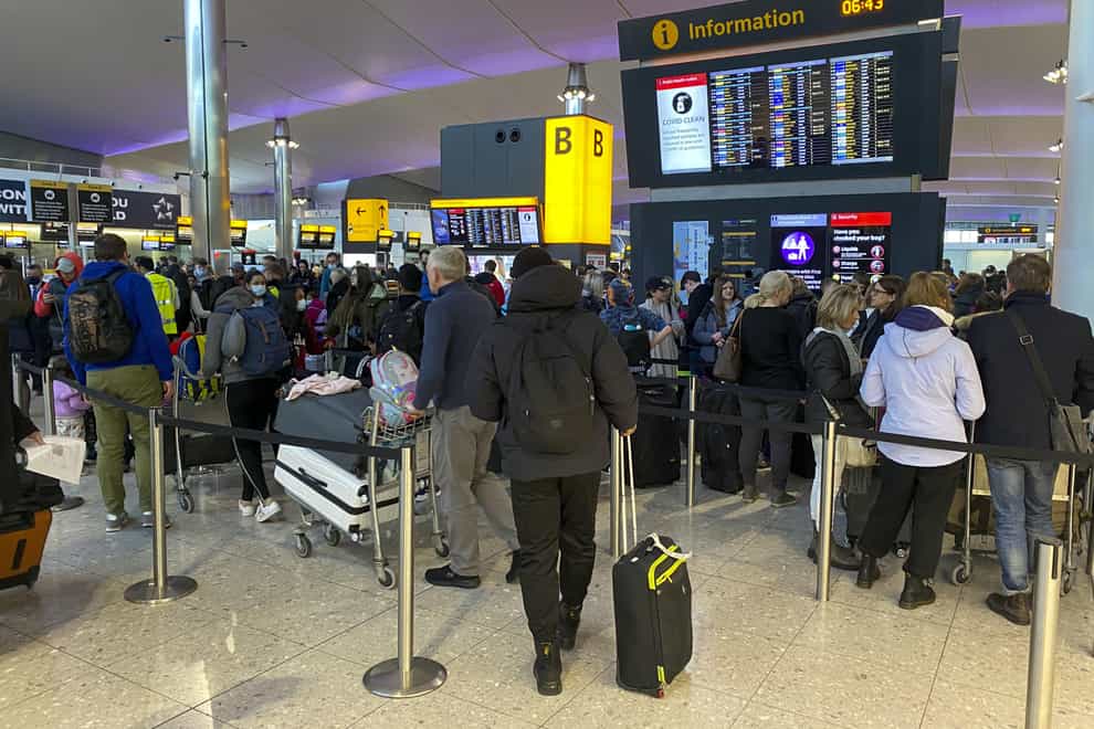Heathrow has increased its prediction of how many passengers will use the airport this year after a strong summer (Steve Parsons/PA)