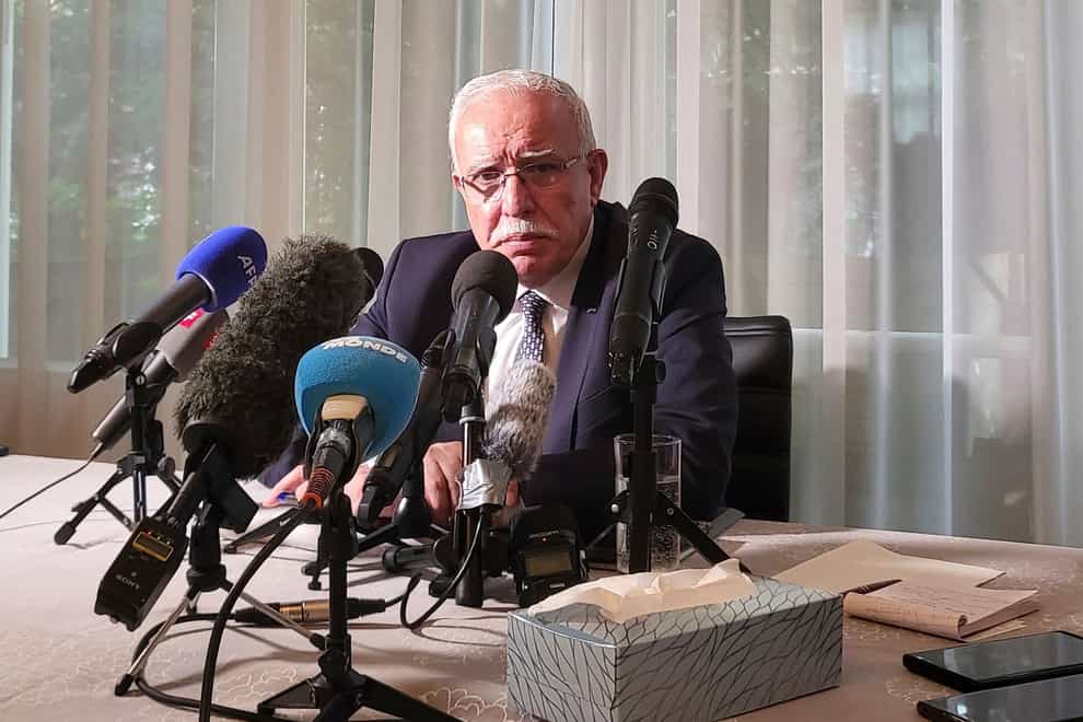 The Palestinian Authority’s foreign minister Riyad al-Maliki speaks to reporters in The Hague (Molly Quell/AP)