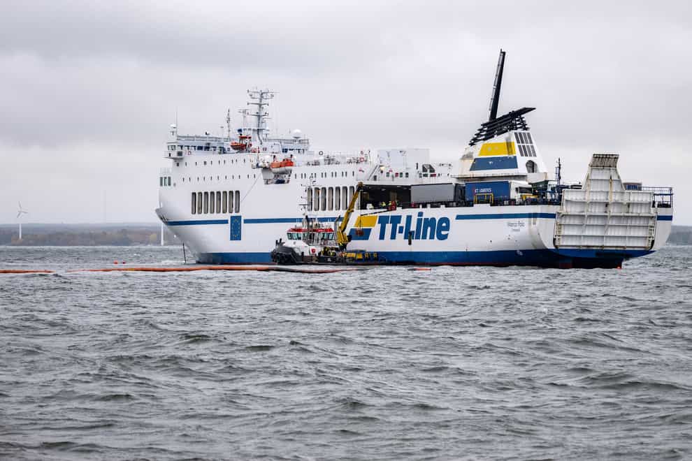 The grounded ferry Marco Polo and the tug Max are seen outside Horvik, southern Sweden, on October 26 (Johan Nilsson/TT News Agency via AP)