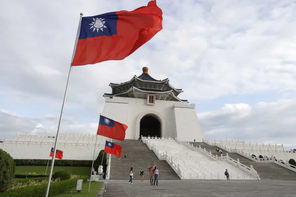 People visit Chiang Kai-shek Memorial Hall in Taipei, Taiwan, on Monday (Chiang Ying-ying/AP)