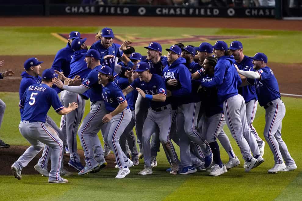 Texas Rangers celebrate after winning Game 5 of the baseball World Series against the Arizona Diamondbacks (Ross D Franklin/AP)