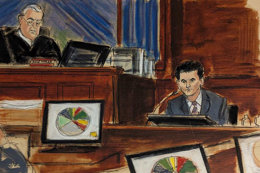 In this courtroom sketch, FTX founder Sam Bankman-Fried, right, testifies as Judge Lewis Kaplan, upper left, presides during Bankman-Fried’s trial in Manhattan federal court (Elizabeth Williams via AP)