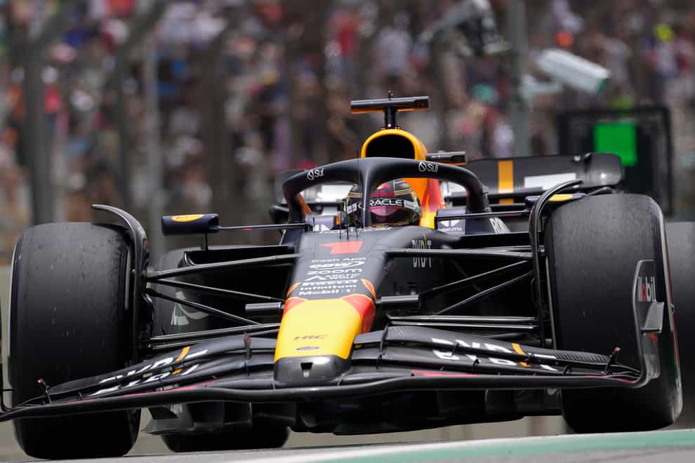 Max Verstappen beat the weather to claim pole (Andre Penner/AP)