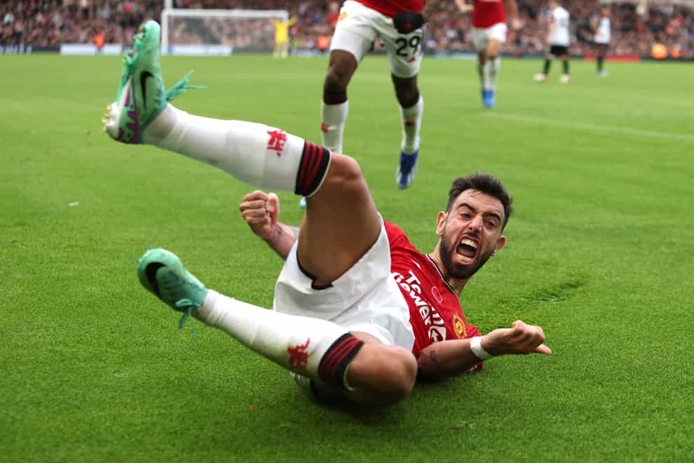 Manchester United captain Bruno Fernandes celebrates his injury-time winner at Fulham (Kieran Cleves/PA).