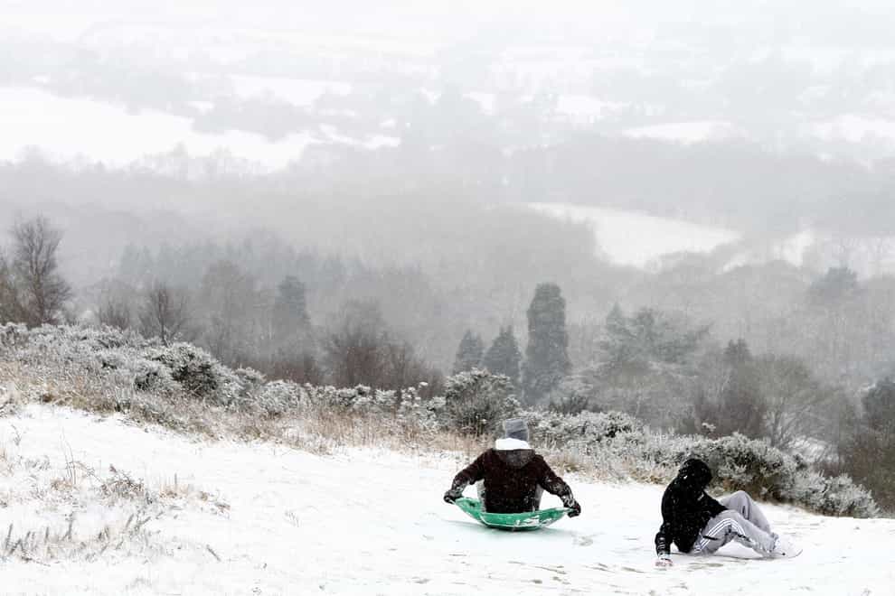 Two boys take advantage of the weather conditions to go sledging on the Malvern Hills, Worcestershire (David Davies/PA)