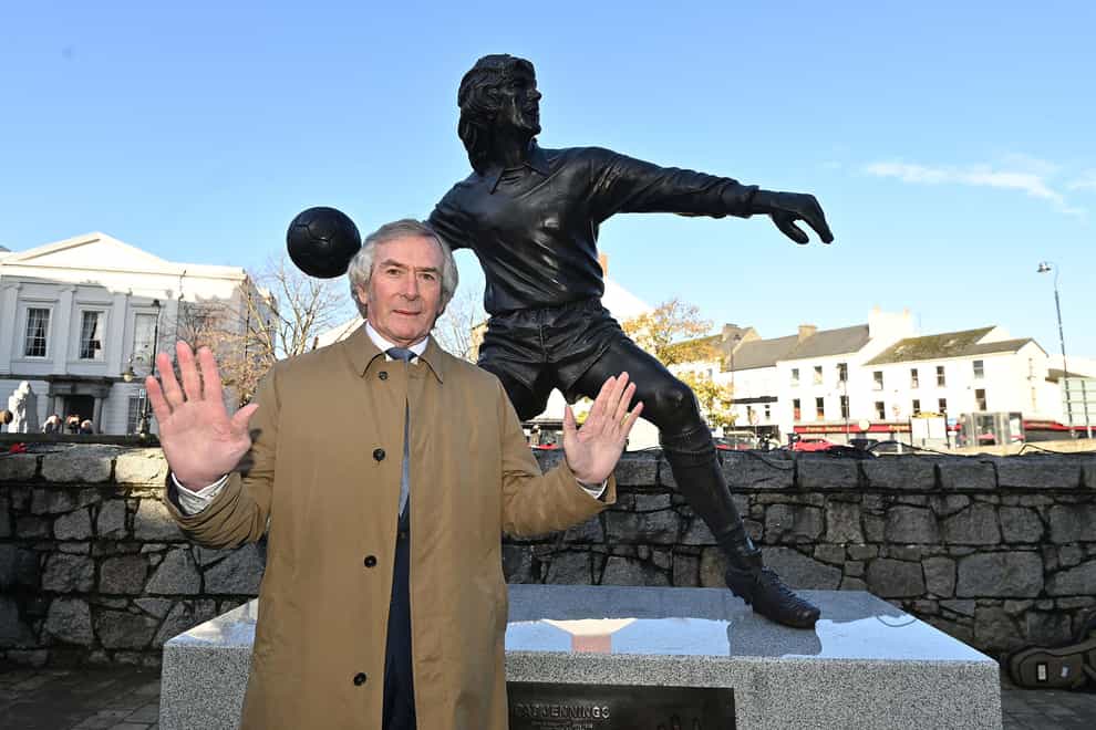 Pat Jennings stands alongside the new statue of him in Newry, Northern Ireland (Oliver McVeigh/PA)