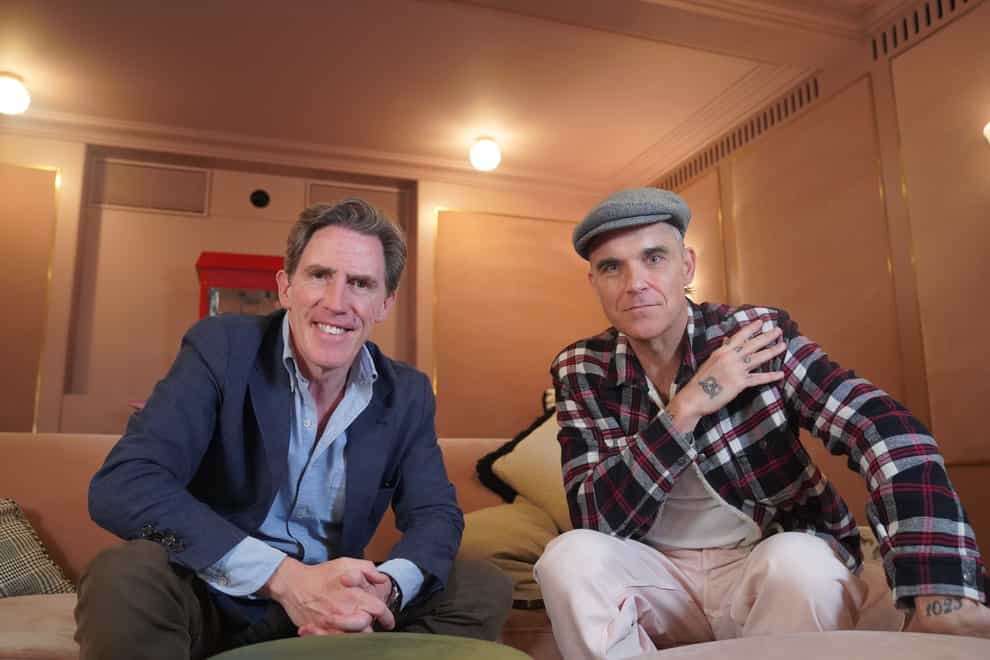 Rob Brydon speaks to Robbie Williams for the new episode of his podcast (Wondery/PA)