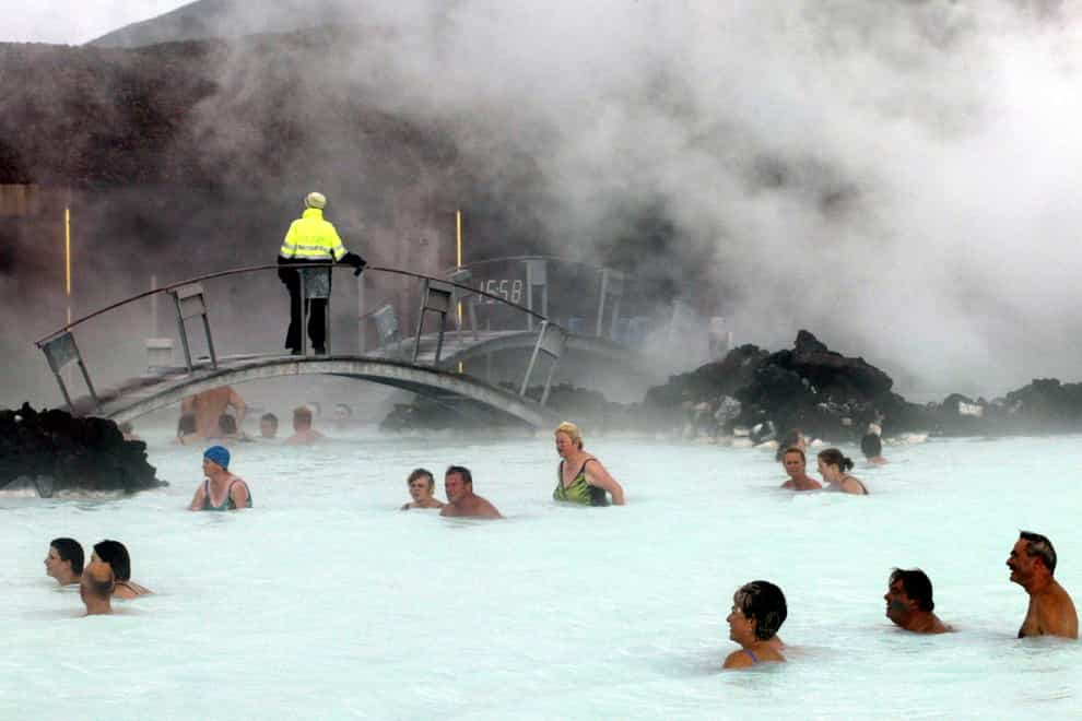 Bathers enjoy the warm water of the Blue Lagoon in Iceland (AP Photo/Frank Augstein, File)