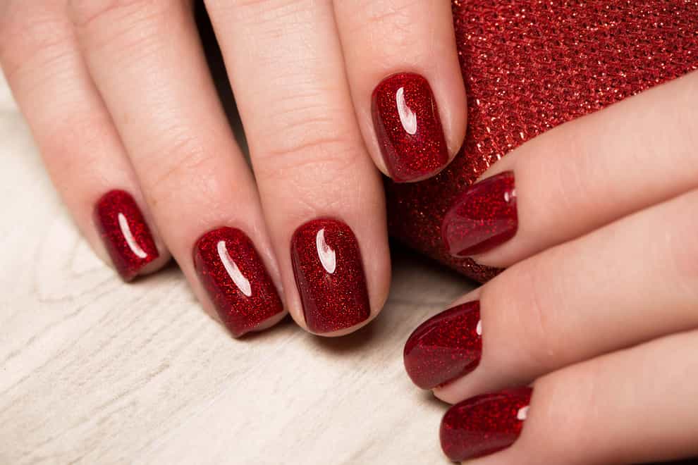 Nail your Christmas party look with a rich rouge shade (Alamy/PA)