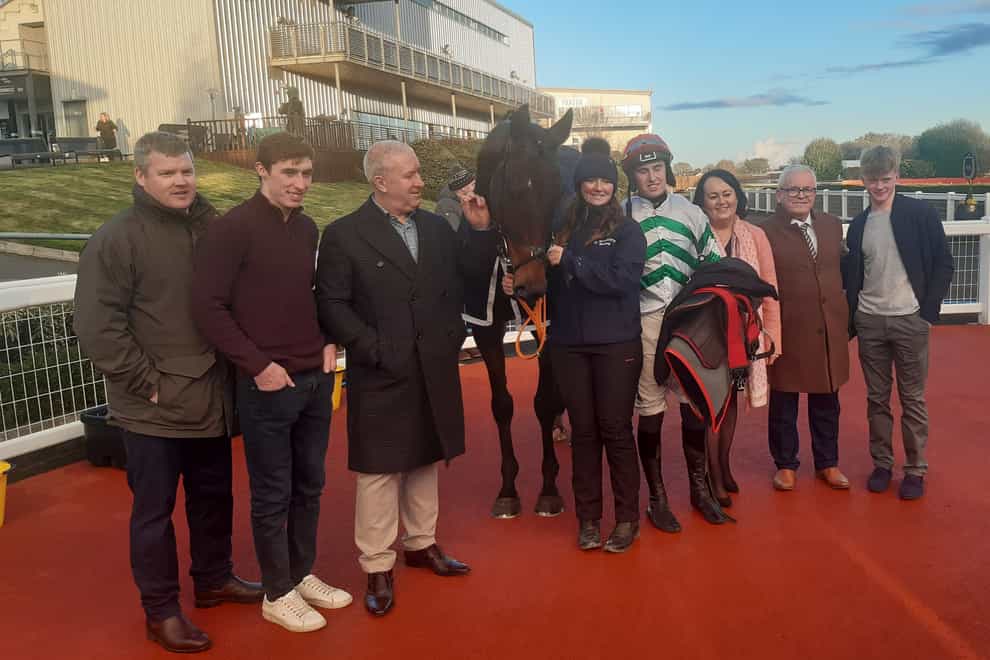 Gordon Elliott and his team after six winners at Down Royal (with Firefox) (PA)