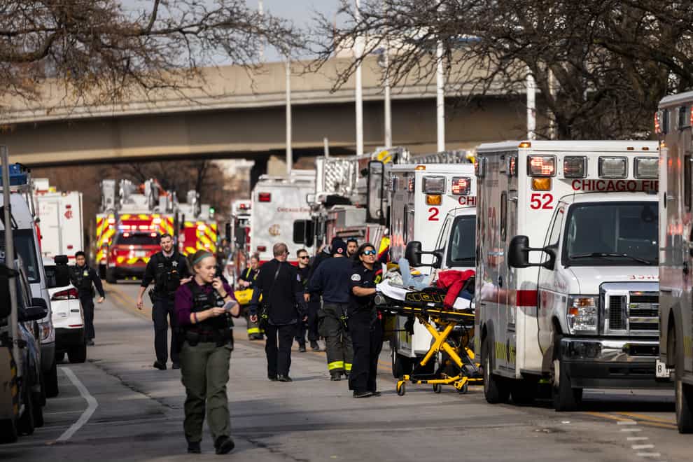 Ambulances lined up after the crash (Ashlee Rezin /Chicago Sun-Times/AP)