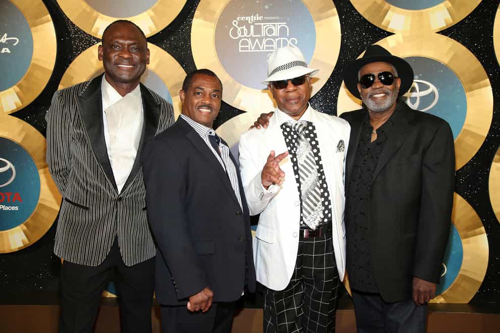 George Brown, left, with Ronald Bell, Dennis Thomas and Robert ‘Kool’ Bell, of Kool & The Gang (Omar Vega/Invision/AP)