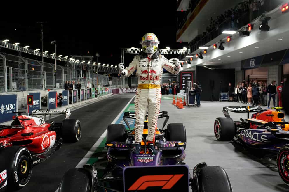 Red Bull driver Max Verstappen, of the Netherlands, stands on top of his car after winning the Formula One Las Vegas Grand Prix (John Locher/AP)