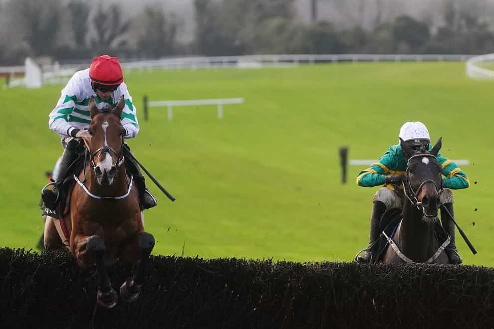 American Mike (left) ridden by Jack Kennedy clears the last on the way to winning the Race And Stay Irish EBF Beginners Steeplechase on day two of the Navan Racing Festival at Navan Racecourse (Brian Lawless/PA)