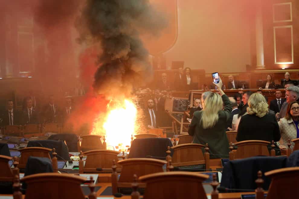 A fire broke out in parliament in Tirana (AP)
