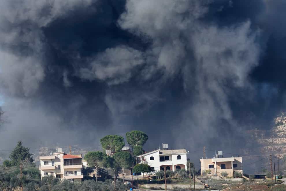 Black smoke rises from an Israeli air strike on the outskirts of Aita al-Shaab, a Lebanese border village (Hussein Malla/AP)