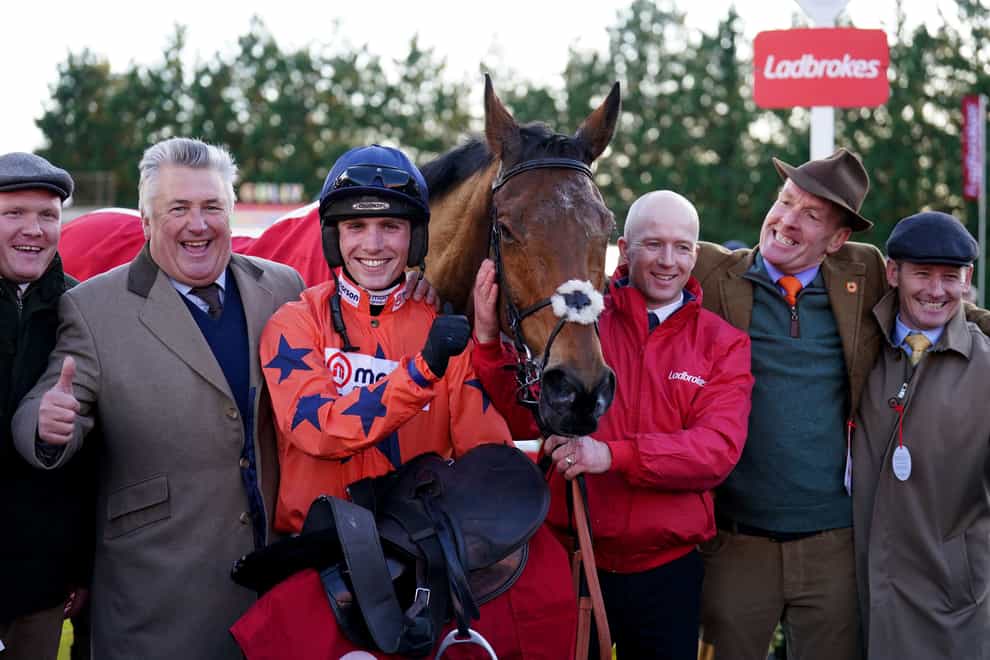 Trainer Paul Nicholls (left), Jockey Harry Cobden (centre left) and owner Bryan Drew (second right) celebrate winning The Ladbrokes King George VI Chase with Bravemansgame (John Walton/PA)