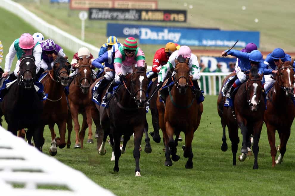 Dream Ahead ridden by Hayley Turner (centre, red and green cap) wins the Darley July Cup during the July Festival at Newmarket Racecourse.