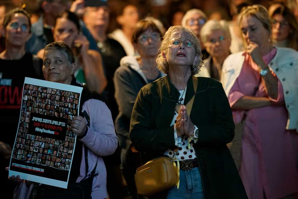 People participate in a show of solidarity with hostages being held in the Gaza Strip, near the Museum of Art in Tel Aviv, Israel, on Saturday (Leo Correa/AP)