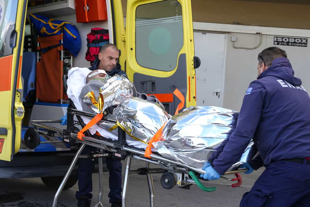 Paramedics transfer a survivor of the shipwreck to hospital on the Greek island of Lesbos (AP Photo/Panagiotis Balaskas)