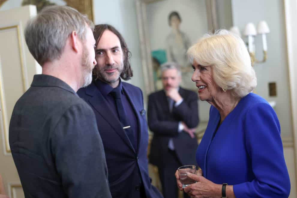 Queen Camilla speaks to author Paul Murray (left) and Paul Lynch (centre). (Chris Jackson/PA)