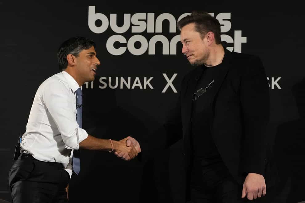 Prime Minister Rishi Sunak shakes hands with Elon Musk (Kirsty Wigglesworth/PA)