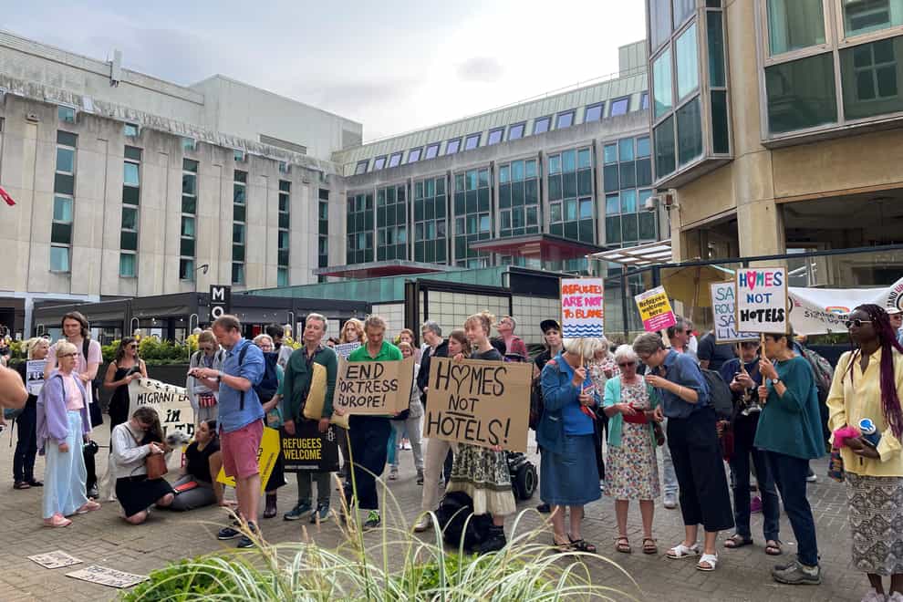 People gathered outside Brighton Town Hall in June in support of Brighton and Hove City Council’s plan to launch legal action against the Home Office for reopening a hotel where more than 100 unaccompanied asylum-seeking children went missing (PA)