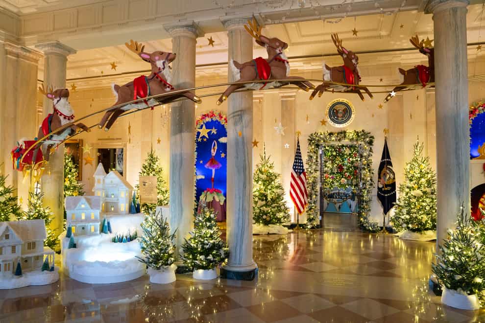 Holiday decorations adorn the Grand Foyer of the White House for the 2023 theme Magic, Wonder and Joy (Evan Vucci/AP)