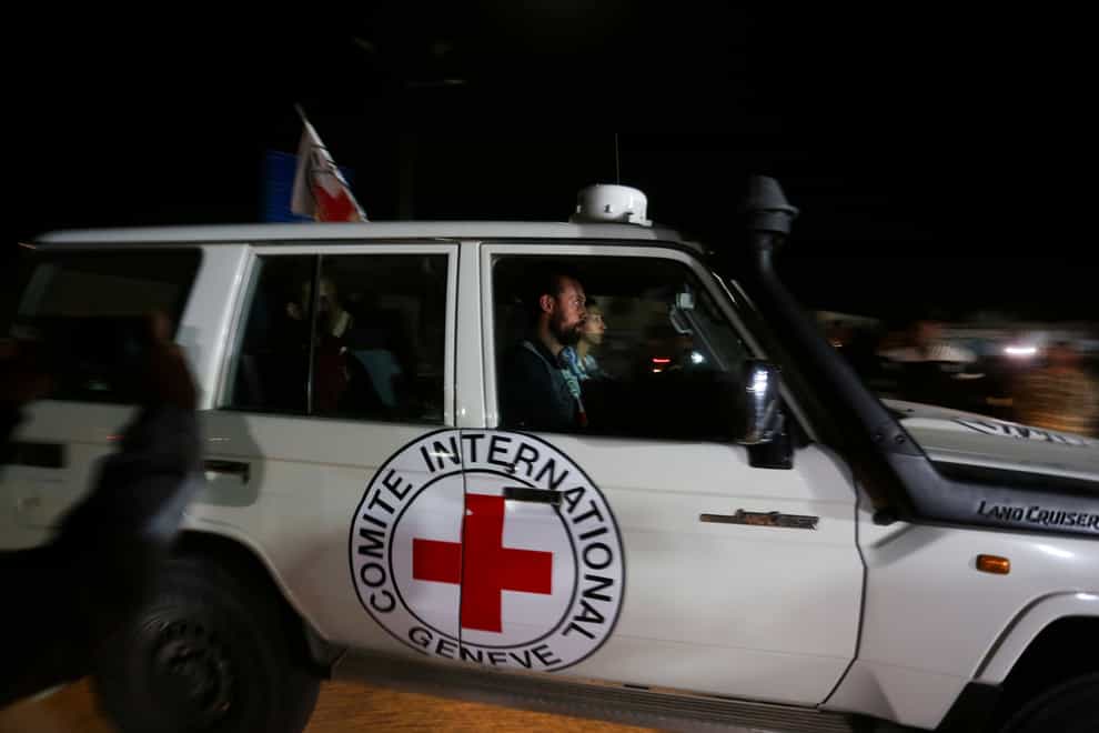 A Red Cross convoy carrying Israeli hostages (Hatem Ali/AP)