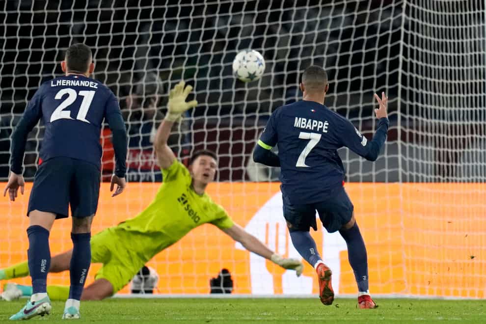 Kylian Mbappe scores a controversial late penalty to draw with Newcastle (Christope Ena/AP)