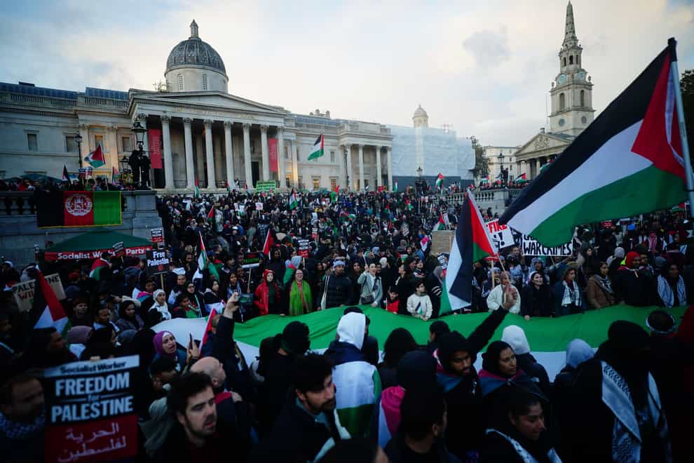 People at a rally in Trafalgar Square, London, during Stop the War coalition’s call for a Palestine ceasefire (Victoria Jones/PA)