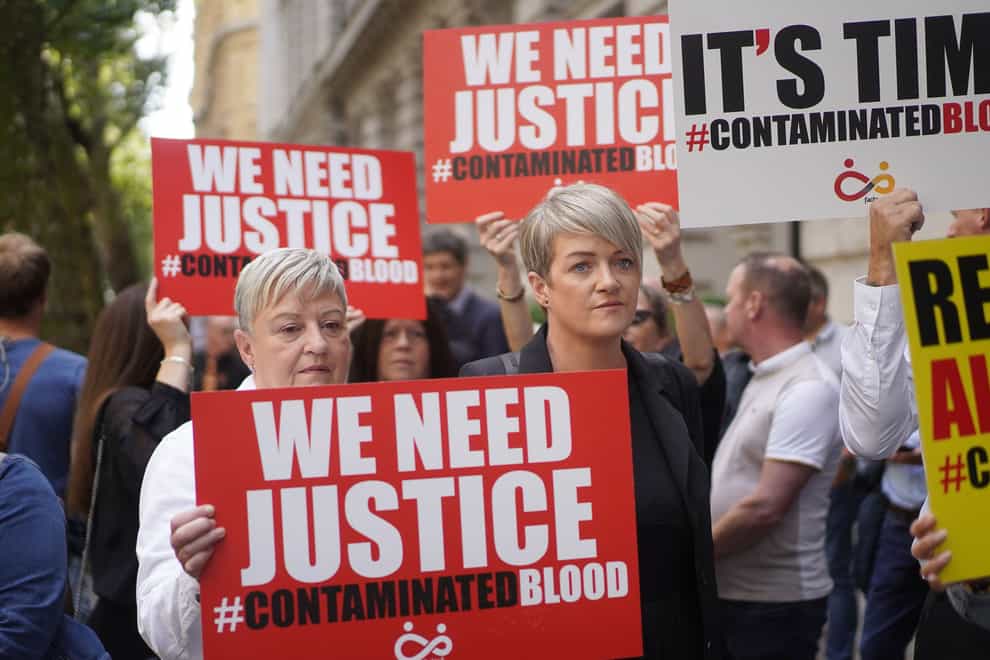 Campaigners calling for compensation for victims at the Infected Blood inquiry (PA)