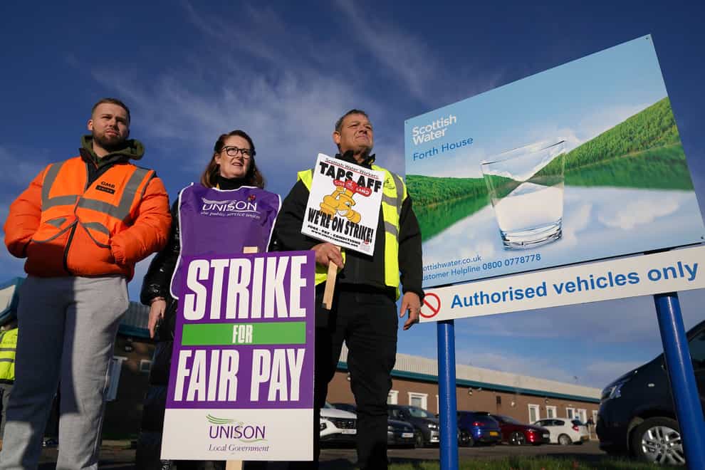Members of the Unite, Unison and GMB unions on the picket line (Andrew Milligan/PA)