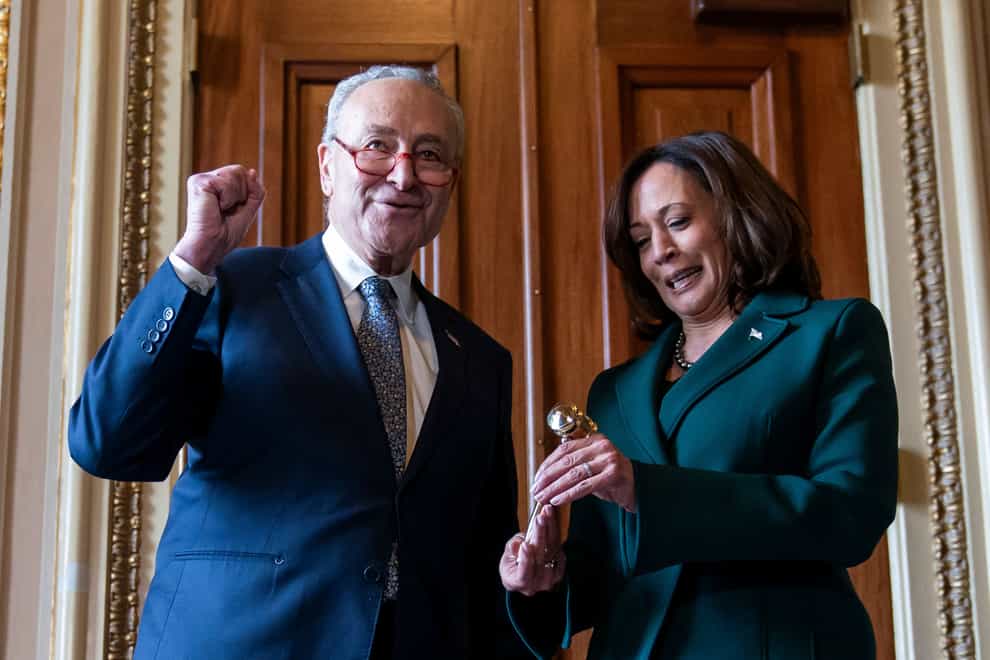 Senate Majority Leader Chuck Schumer presents Vice President Kamala Harris with a golden gavel (Stephanie Scarbrough/AP)