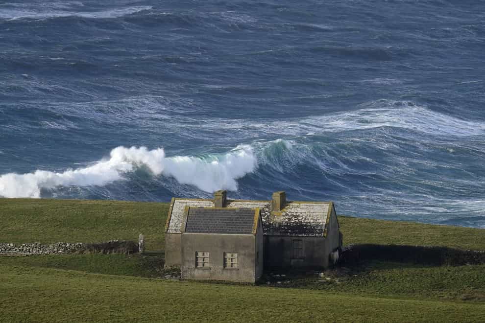 Waves crashing against the shore at Doolin in County Clare on the west coast of Ireland (Niall Carson/PA)