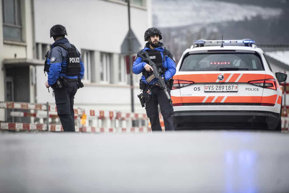Police at the scene after a shooting incident in Sion, Switzerland (Louis Dasselborne/Keystone via AP)