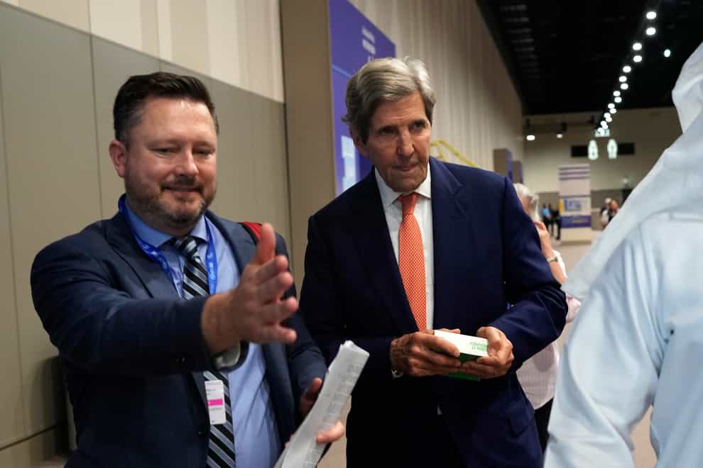 John Kerry, US special presidential envoy for climate, leaves talks at the Cop28 UN Climate Summit (Rafiq Maqbool/AP)