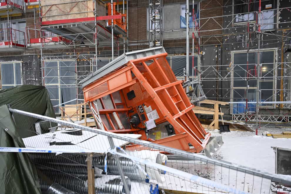 The initial investigation into the crash of a building site lift which killed five people has been expanded to include two more possible workplace violations, a Swedish prosecutor has said (Fredrik Sandberg/TT News Agency via AP)