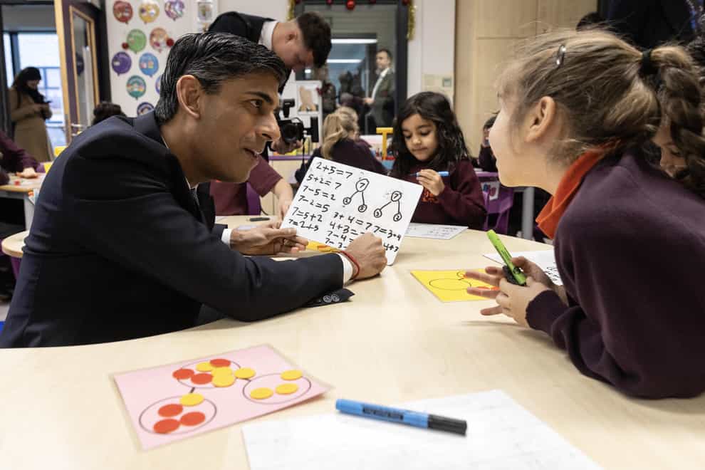 Prime Minister Rishi Sunak speaks to pupils in a year one maths class during a visit to the Wren Academy school in Finchley, north London (Richard Pohle/The Times/PA)