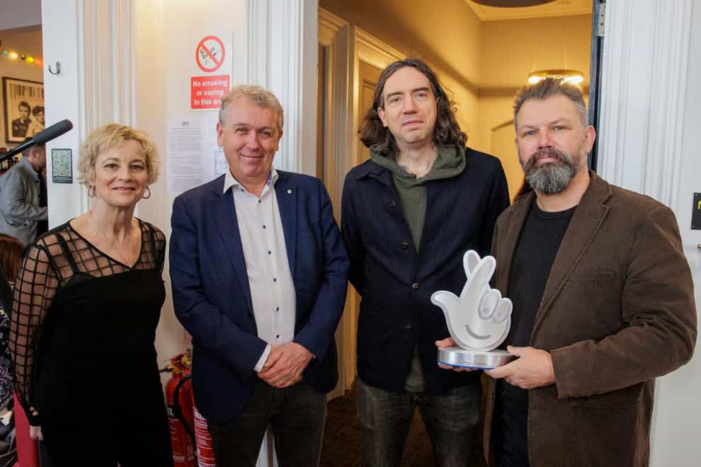 Snow Patrol frontman Gary Lightbody (third from left) with Dr Paul Mullan (second from left), Northern Ireland director at the National Lottery and Open House founders Alison Gordon (left) and Kieran Gilmore (right) at the Court House Bangor (Liam McBurney/PA)