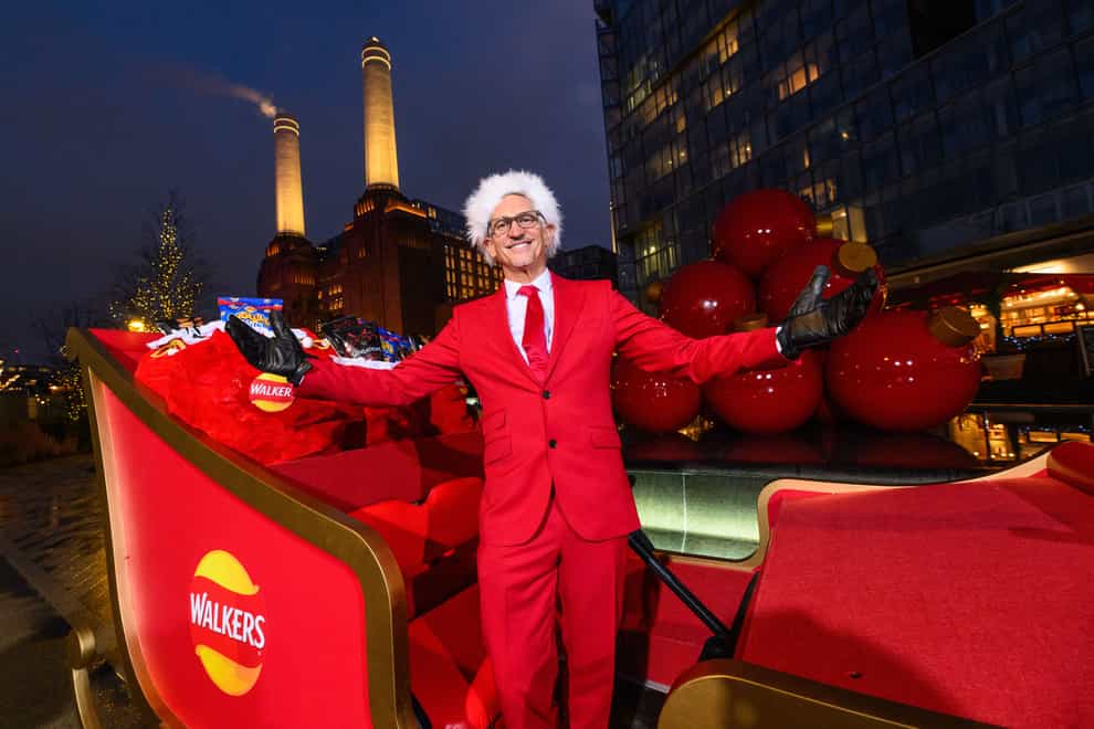 Gary Lineker surprises members of the public by driving a sleigh full of Walkers crisps around Battersea Power Station while dressed as ‘Father Crisp-mas’ to mark his 30th year working with the brand (Matt Crossick/PA)