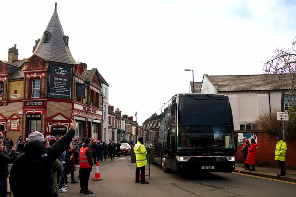 EDITORS NOTE: GESTURE The Manchester United team bus arrives at the stadium ahead of the Premier League match at Anfield, Liverpool. Picture date: Sunday December 17, 2023.