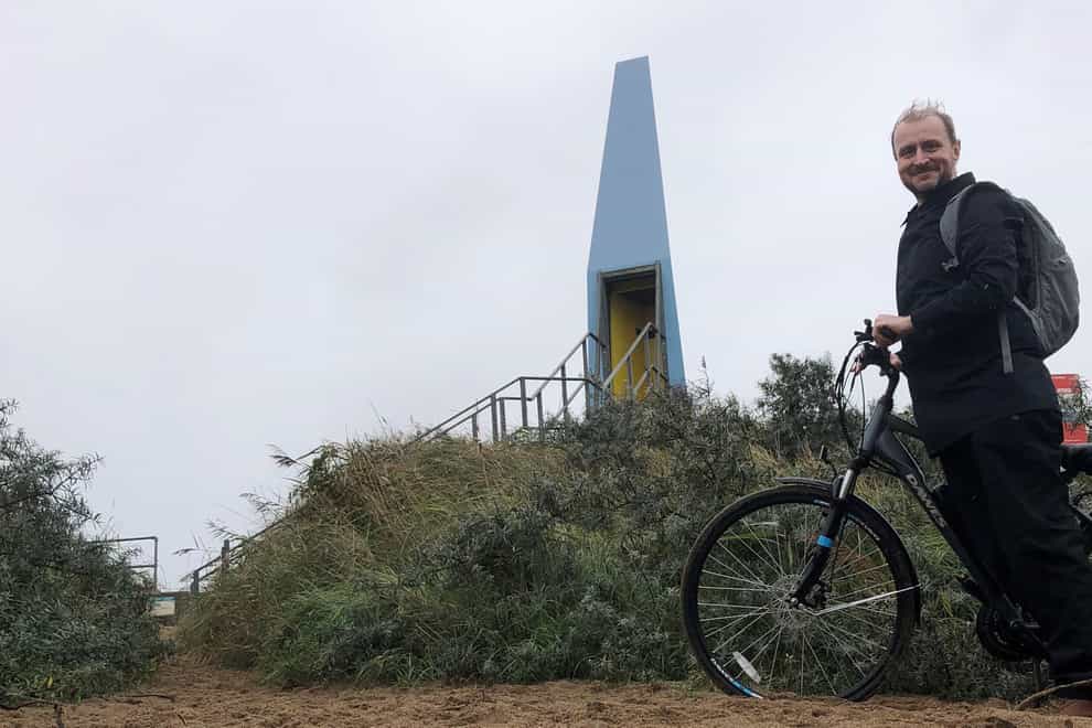 Damon Smith and his e-bike at The Sound Tower in Chapel St Leonards (Damon Smith/PA)