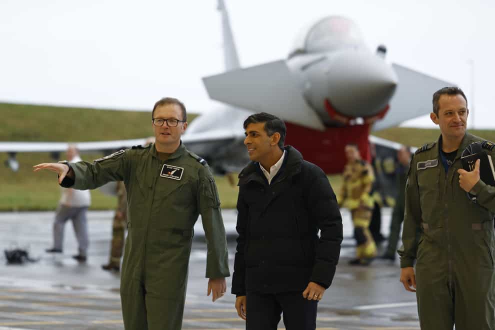 Prime Minister Rishi Sunak, centre, visits RAF Lossiemouth military base in Moray (Jeff J Mitchell/PA)