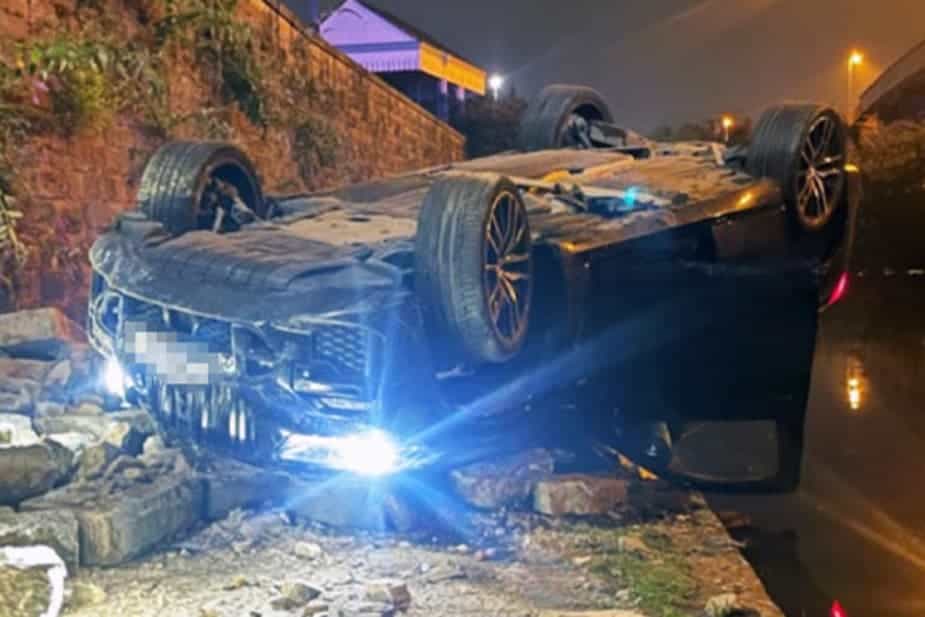 The BMW crashed through a wall and flipped over on to a canal path. (Nottinghamshire Police/PA)